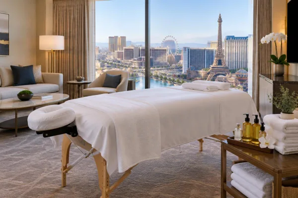 In-room massage table and oils in an illustrated Las Vegas hotel suite